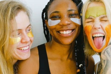 3 women smiling with under eye-patches