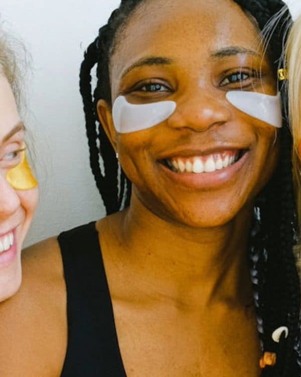 3 women smiling with under eye-patches
