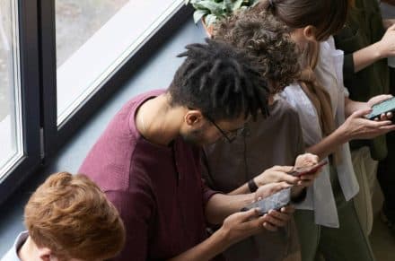 People sitting down browsing their phones