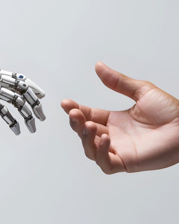 Robot hand reaching out to human hand